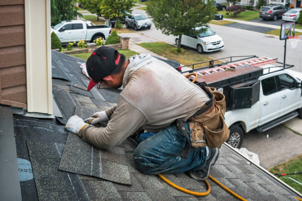Professional Gutter Repair And Installation technician working in Lawrence, NY